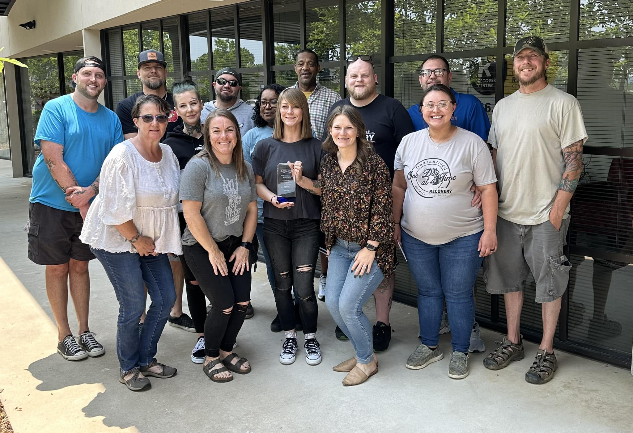 A diverse group of hands, varying in skin tones, stacked together in unity and cooperation, symbolizing solidarity and friendship